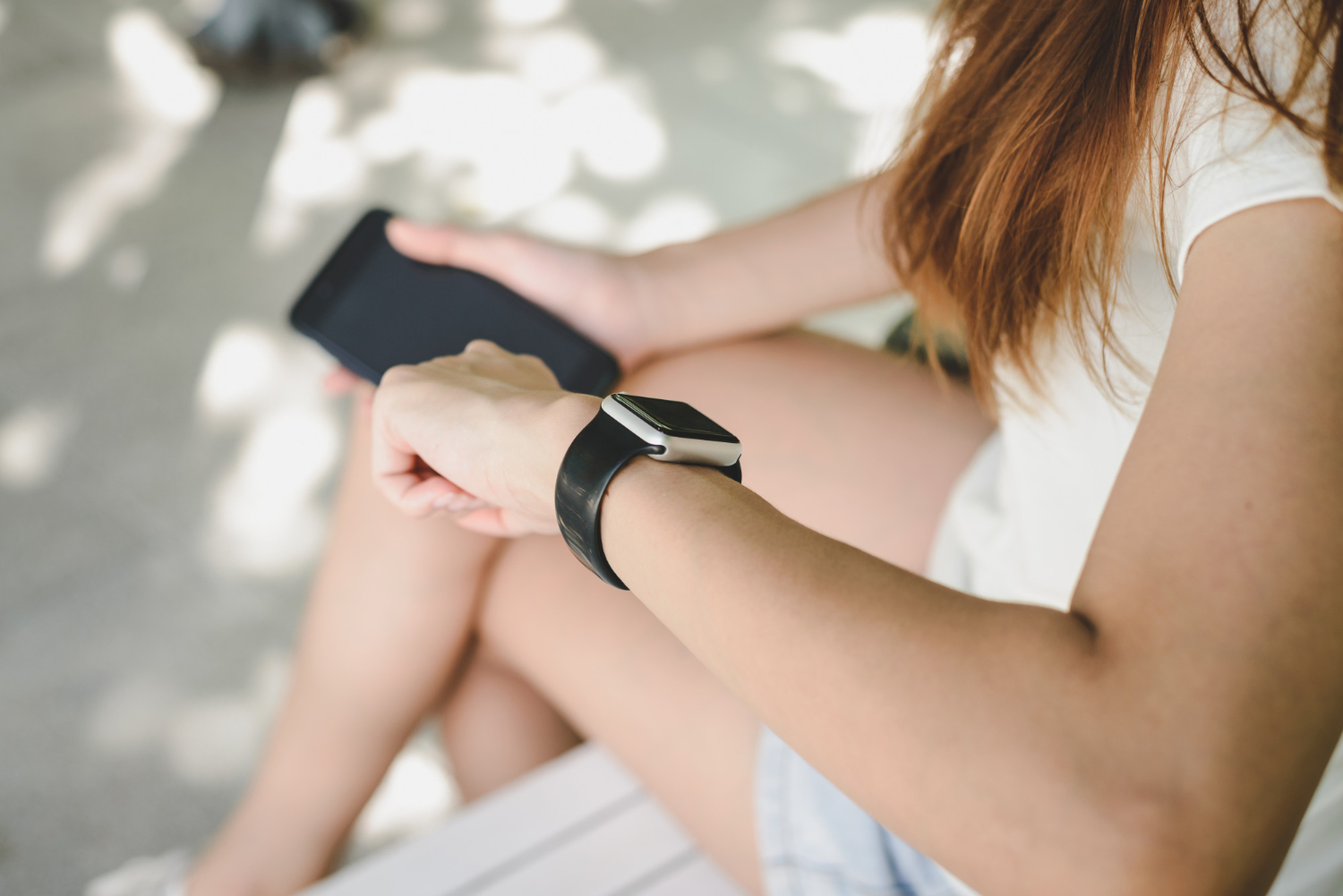 Woman looking at smart watch