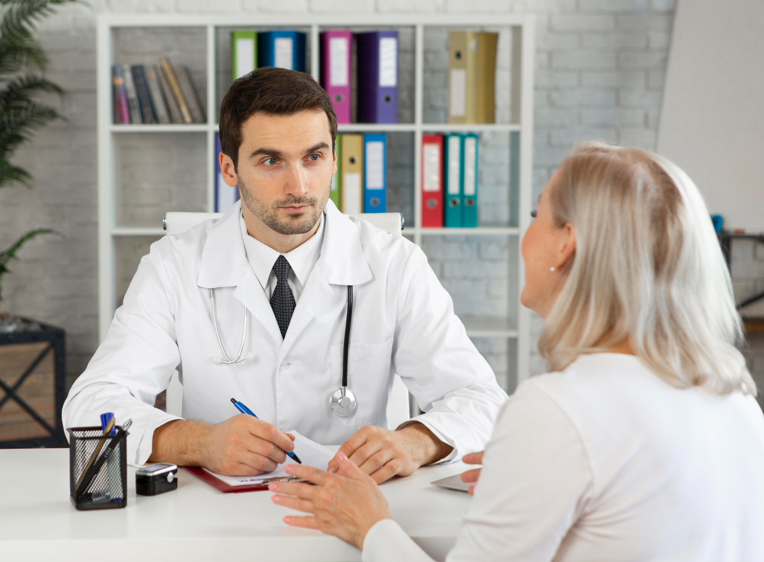 Woman consulting doctor